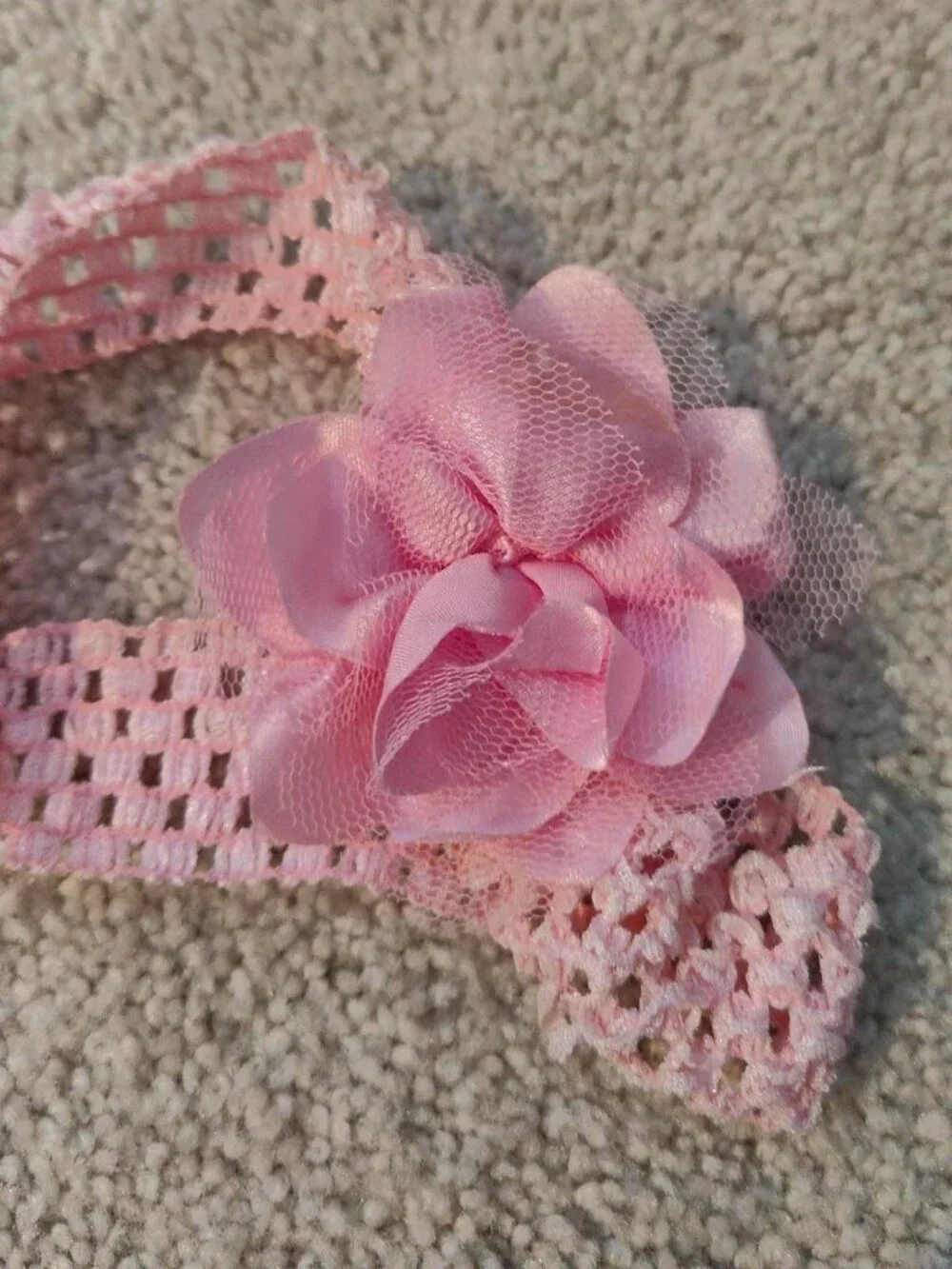 Pink crochet headband with flower detail